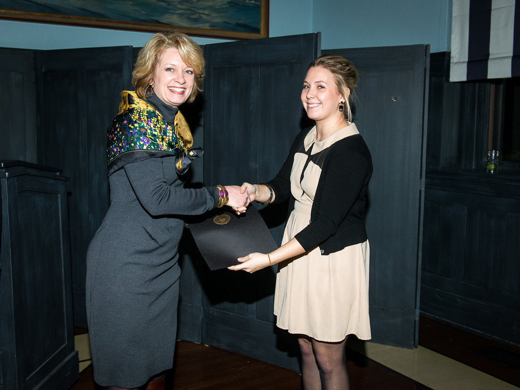 JWU President and 10 to Watch honoree Mim Runey is congratulated by JWU student and Hope Club intern Emily Greagori