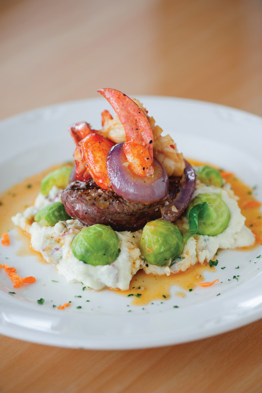 Filet mignon, mashed potato, vegetable, fresh shucked lobster tail and scampi sauce