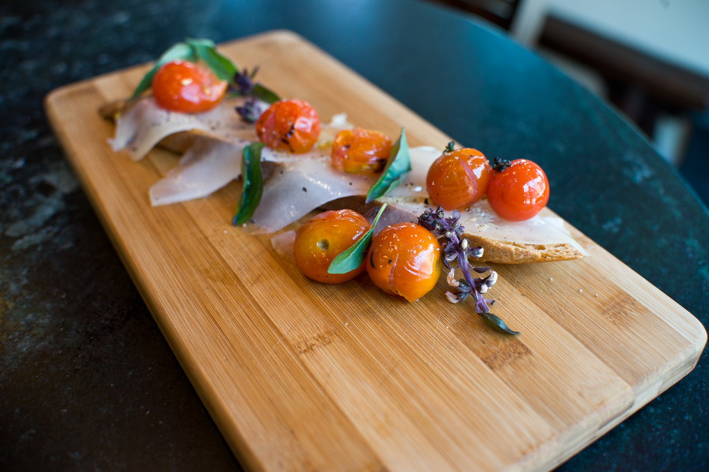 House-Cured Lardo with Blistered Cherry Tomatoes and Crostini