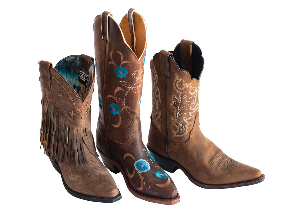 Leather BootsDingo fringe boot, $164.95; Boulet blue flower boot, $249.95; Justin boot, $180.95; all at Allie’s. Allie’s Selling western tack and apparel, pet food and livestock supplies, animal feed, supplements and more, Allie’s takes care of all your animal needs. 3700 Quaker Ln., North Kingstown. 294-9121.