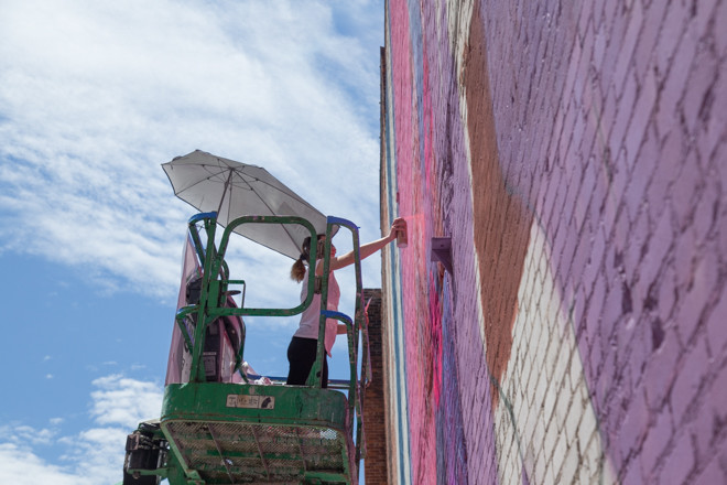 Natalia Rak working on her mural in downtown Providence on Friday, June 5.
