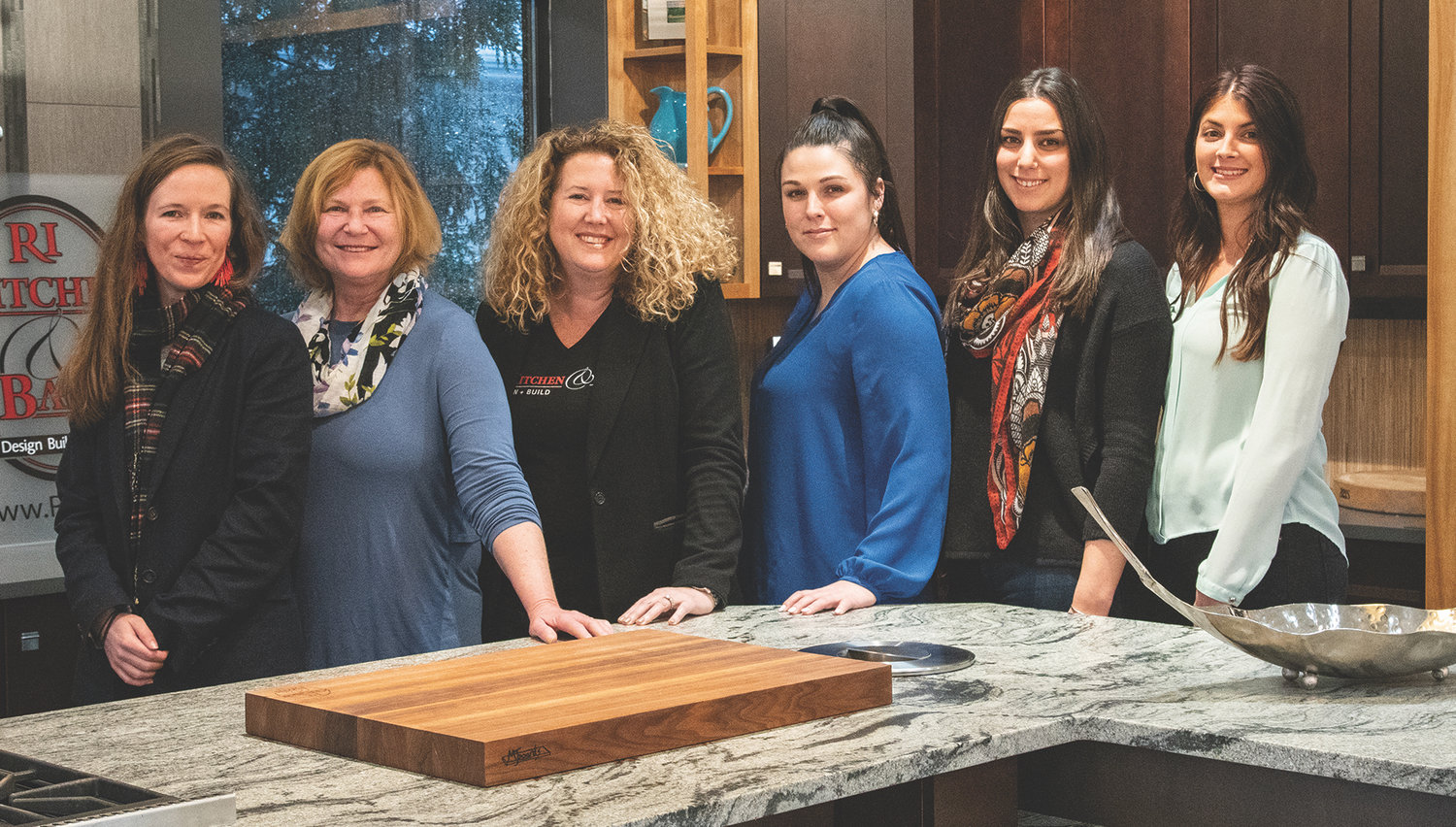Leading Ladies of The Design + Build Team at RI Kitchen & Bath in Warwick, left to right: Erika Pearson, Prudence Stoddard, Tanya Donahue, Billie Senzek, Kingsley Catalucci, and Stephanie McShane
