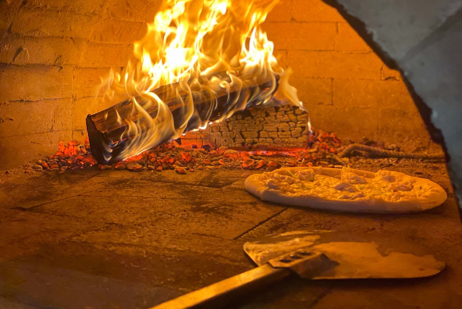 Brick-oven pizza is a staple of the new Valley digs