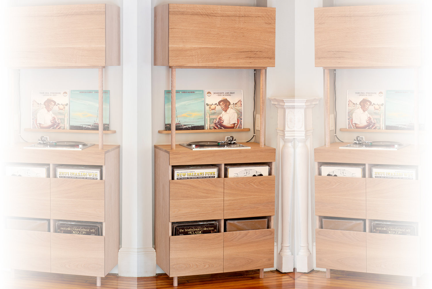 Built-in record cabinet featuring a recessed turntable, integrated no-touch lighting, and matching display shelf