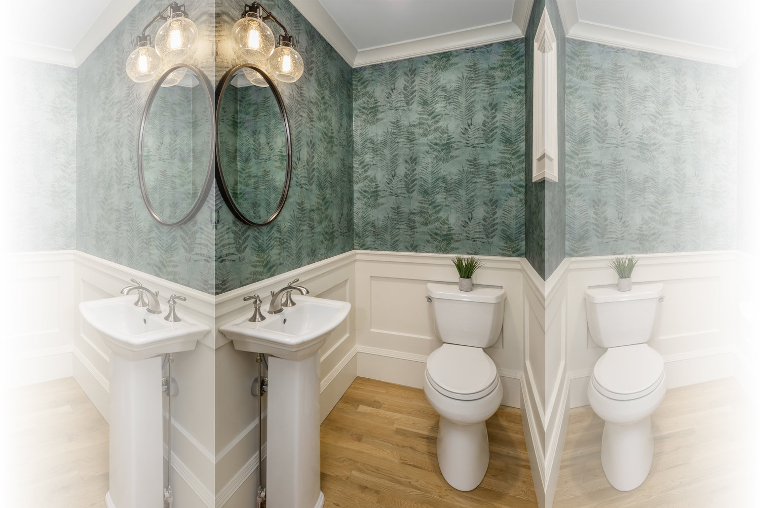Wallpaper and a round mirror are impactful in the half-bath