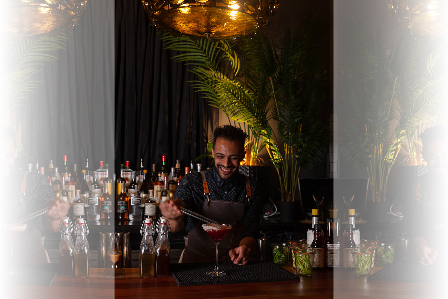 Mixologist Darnell Holguin adds the finishing touch on a craft cocktail from 345