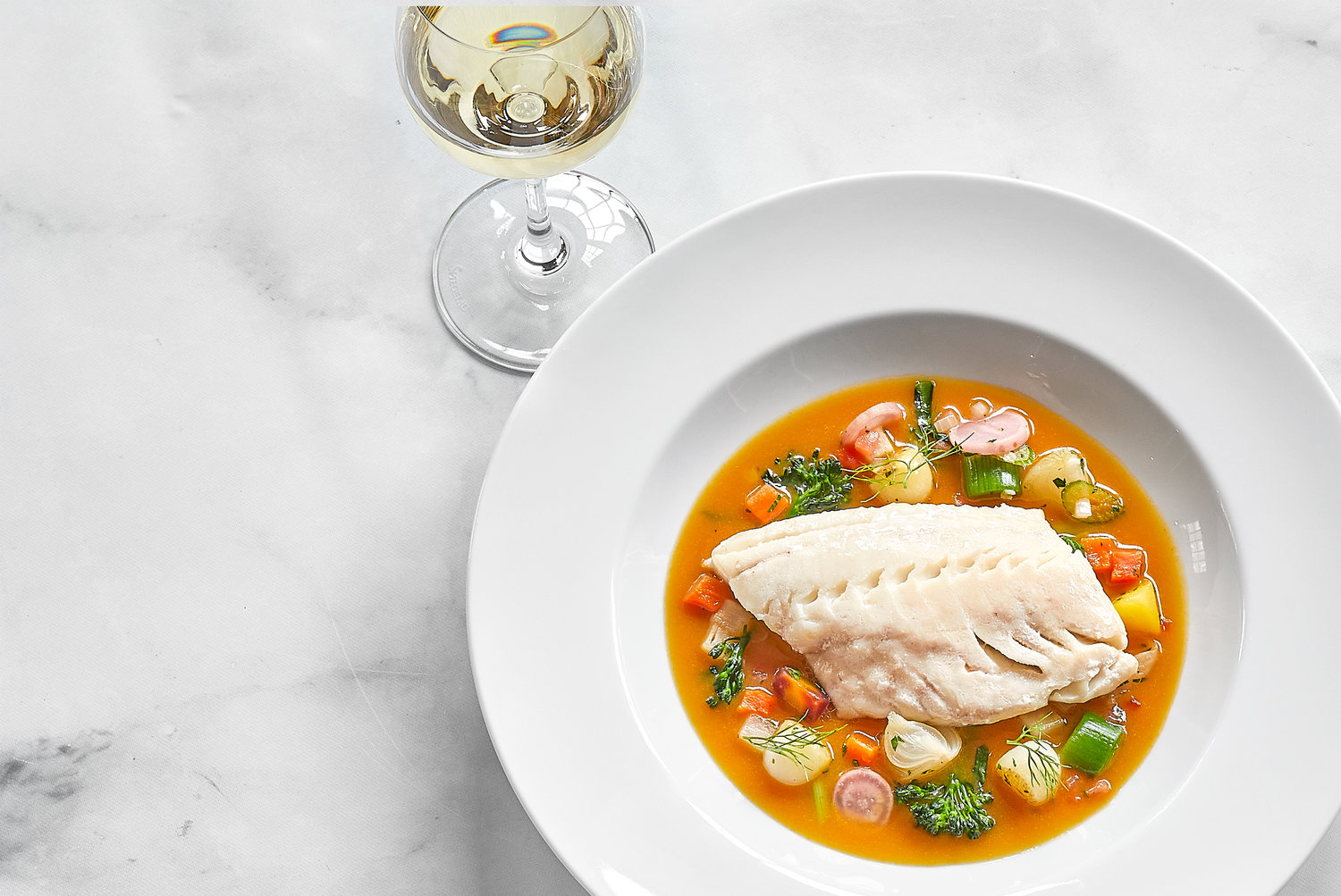 Entrees rotate regularly, but expect elevated seafood options like Black Bass