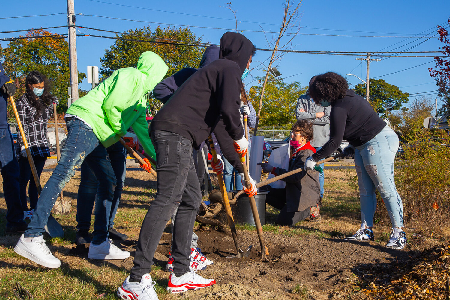 Students from 360 High School and William B. Cooley High School plant trees on their shared school campus, the Juanita Sanchez Educational Complex